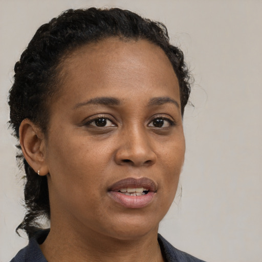 Neutral black young-adult female with short  brown hair and brown eyes