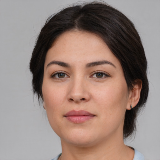 Joyful white young-adult female with medium  brown hair and brown eyes