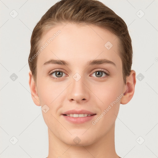 Joyful white young-adult female with short  brown hair and grey eyes