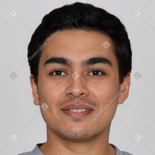 Joyful latino young-adult male with short  black hair and brown eyes