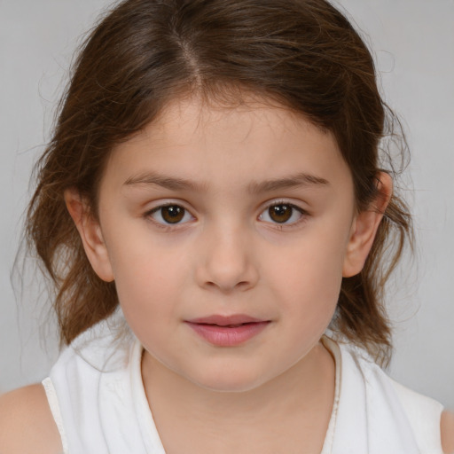 Joyful white child female with medium  brown hair and brown eyes