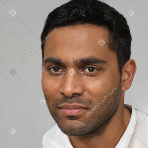 Neutral black young-adult male with short  black hair and brown eyes