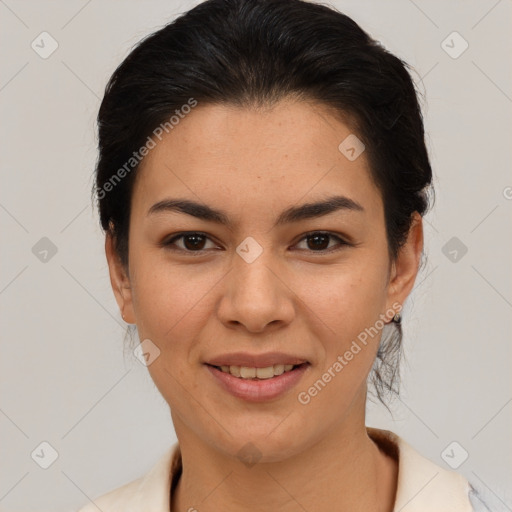 Joyful latino young-adult female with medium  brown hair and brown eyes