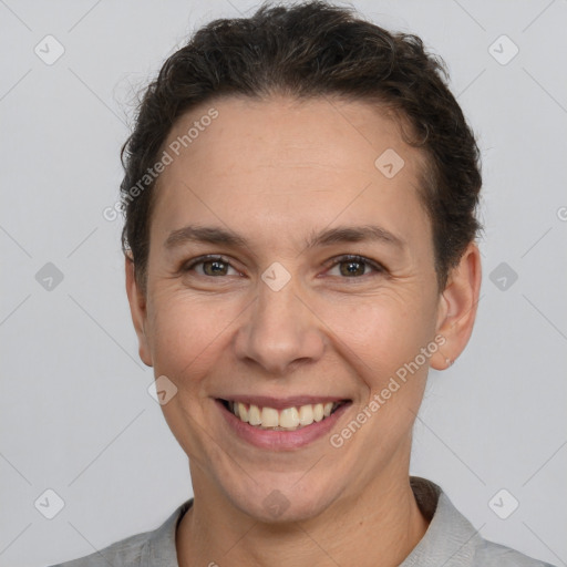 Joyful white adult female with short  brown hair and brown eyes