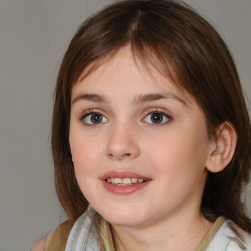 Joyful white child female with medium  brown hair and brown eyes