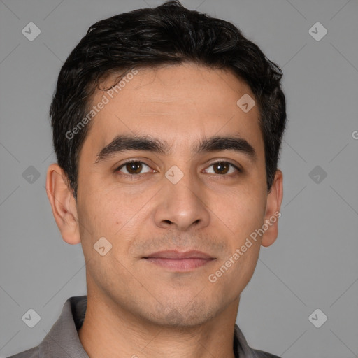 Joyful white young-adult male with short  black hair and brown eyes