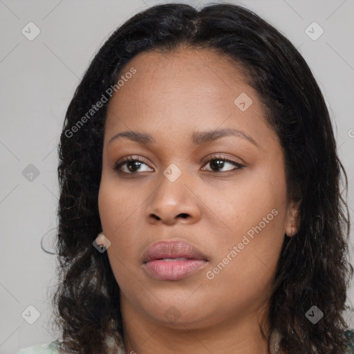 Joyful black young-adult female with long  black hair and brown eyes