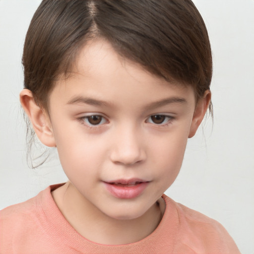 Joyful white child female with short  brown hair and brown eyes