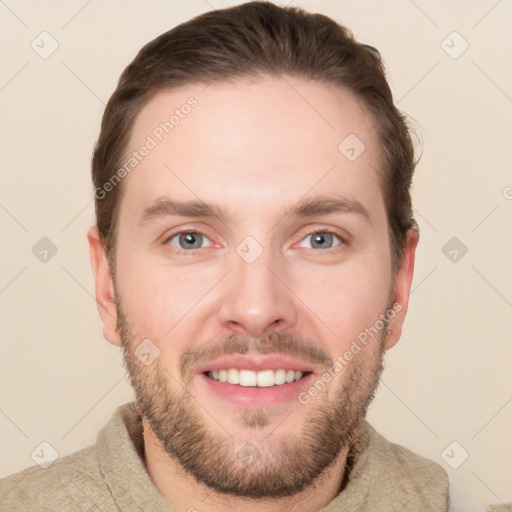 Joyful white young-adult male with short  brown hair and grey eyes