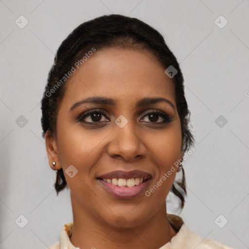 Joyful black young-adult female with short  brown hair and brown eyes