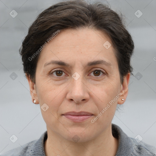 Joyful white adult female with short  brown hair and brown eyes