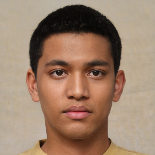 Neutral latino young-adult male with short  black hair and brown eyes