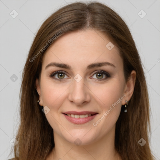 Joyful white young-adult female with long  brown hair and green eyes