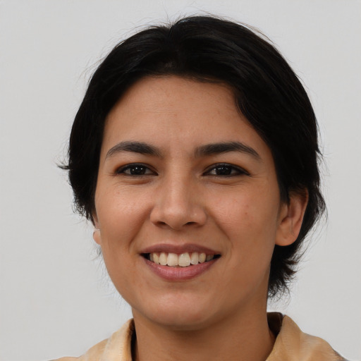 Joyful asian young-adult female with medium  black hair and brown eyes
