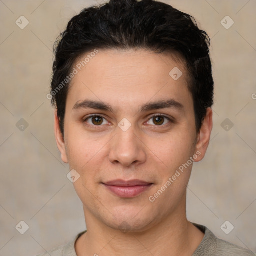 Joyful white young-adult male with short  black hair and brown eyes