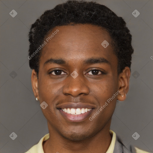 Joyful black young-adult male with short  brown hair and brown eyes