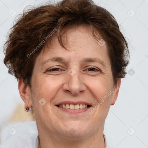 Joyful white adult female with short  brown hair and brown eyes