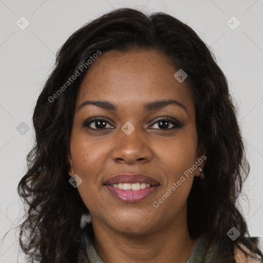 Joyful black young-adult female with long  brown hair and brown eyes