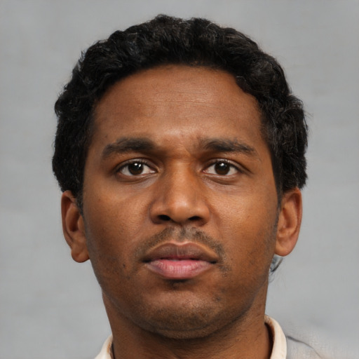 Neutral black young-adult male with short  brown hair and brown eyes