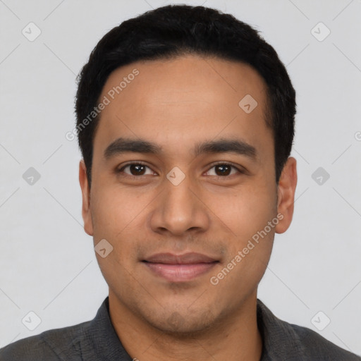 Joyful latino young-adult male with short  black hair and brown eyes