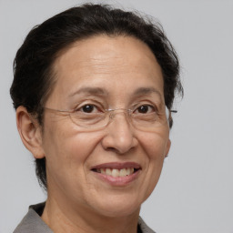 Joyful white middle-aged female with medium  brown hair and brown eyes