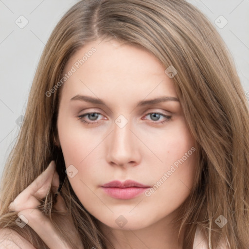 Neutral white young-adult female with long  brown hair and brown eyes