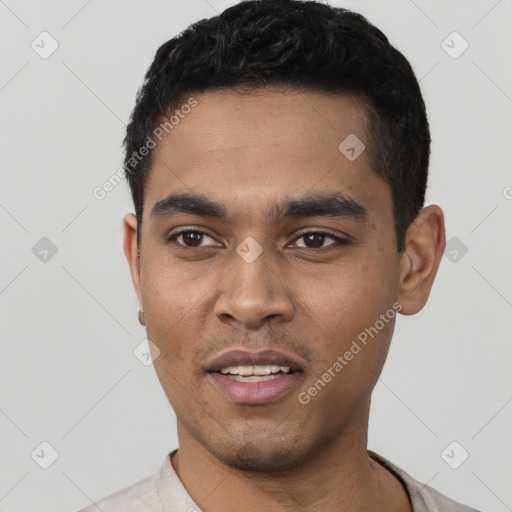 Joyful latino young-adult male with short  black hair and brown eyes