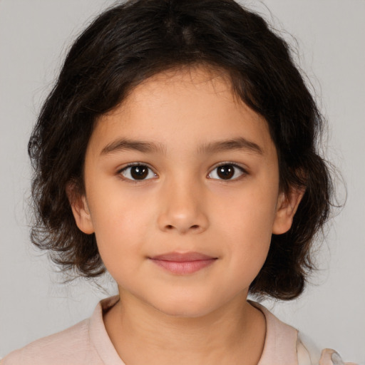 Joyful white child female with medium  brown hair and brown eyes