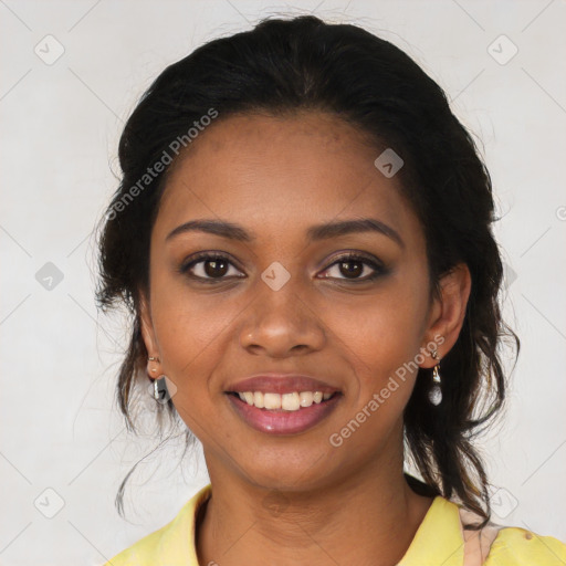 Joyful black young-adult female with long  brown hair and brown eyes