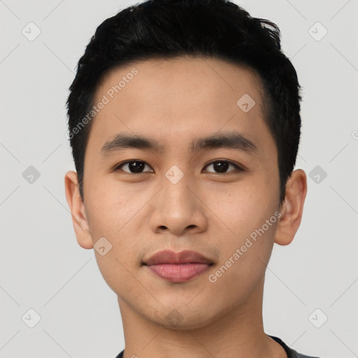 Joyful asian young-adult male with short  black hair and brown eyes