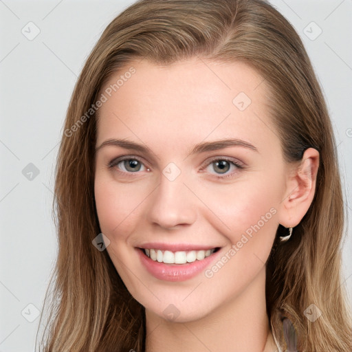 Joyful white young-adult female with long  brown hair and blue eyes