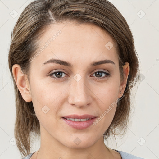 Joyful white young-adult female with medium  brown hair and grey eyes