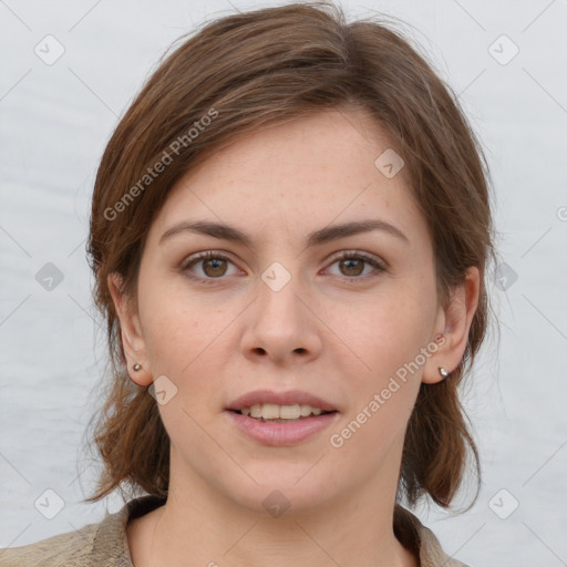 Joyful white young-adult female with medium  brown hair and grey eyes