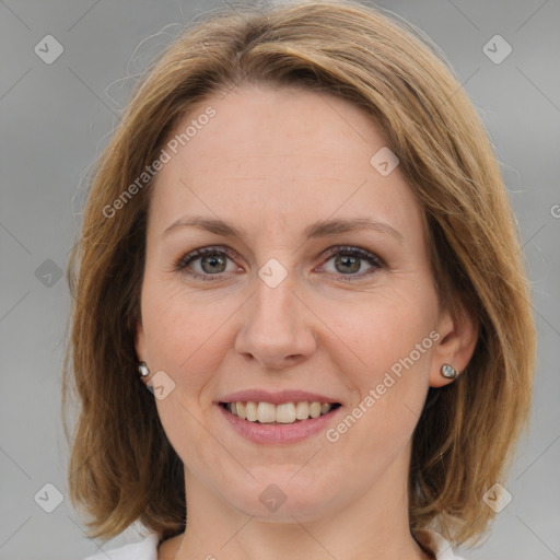 Joyful white adult female with medium  brown hair and grey eyes