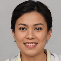 Joyful asian young-adult female with short  brown hair and brown eyes