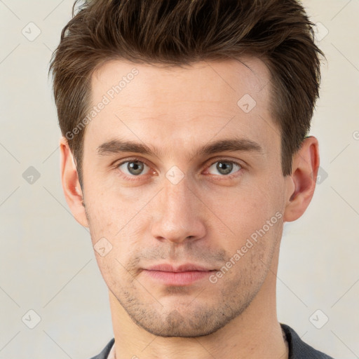 Neutral white young-adult male with short  brown hair and grey eyes