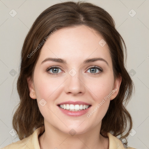 Joyful white young-adult female with medium  brown hair and green eyes