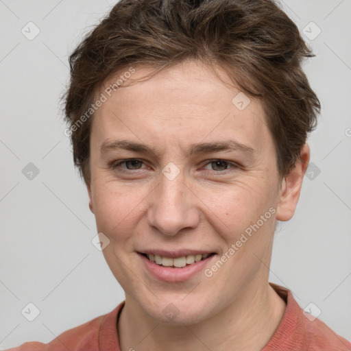 Joyful white young-adult female with short  brown hair and grey eyes