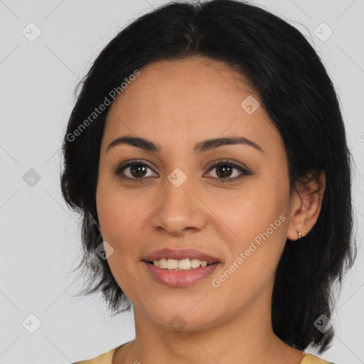 Joyful latino young-adult female with medium  black hair and brown eyes