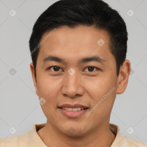 Joyful asian young-adult male with short  brown hair and brown eyes