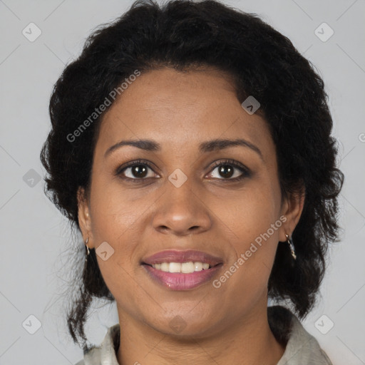 Joyful black adult female with medium  brown hair and brown eyes