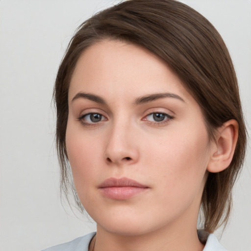 Neutral white young-adult female with medium  brown hair and grey eyes