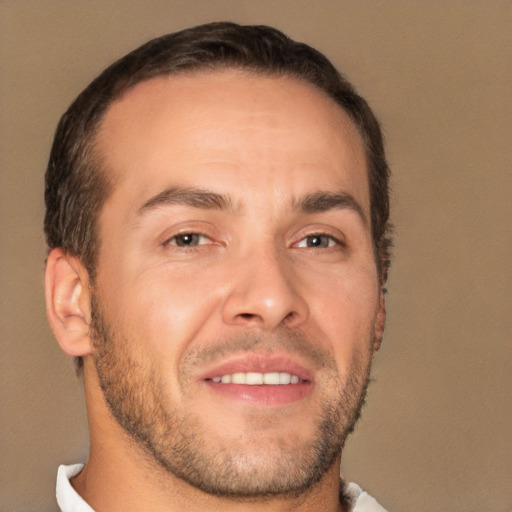 Joyful white adult male with short  brown hair and brown eyes