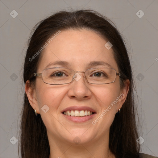 Joyful white adult female with long  brown hair and brown eyes