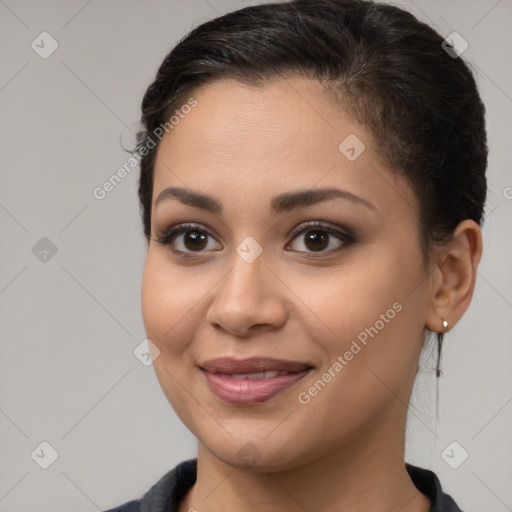 Joyful latino young-adult female with medium  brown hair and brown eyes