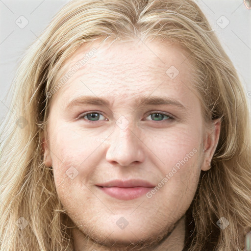 Joyful white young-adult female with long  brown hair and green eyes