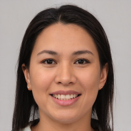 Joyful asian young-adult female with medium  brown hair and brown eyes