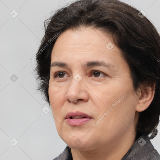 Joyful white adult female with medium  brown hair and brown eyes