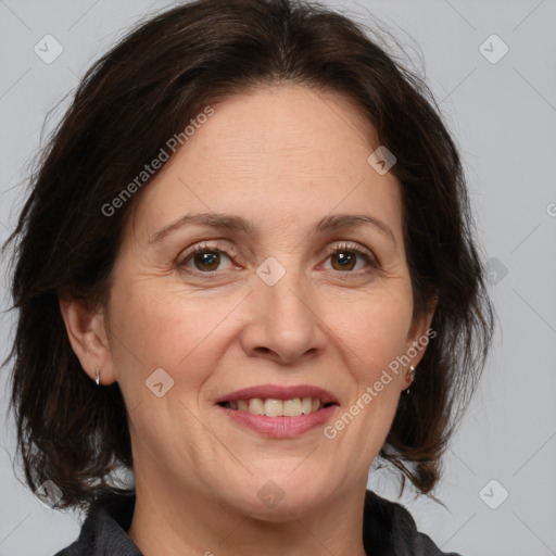 Joyful white adult female with medium  brown hair and brown eyes