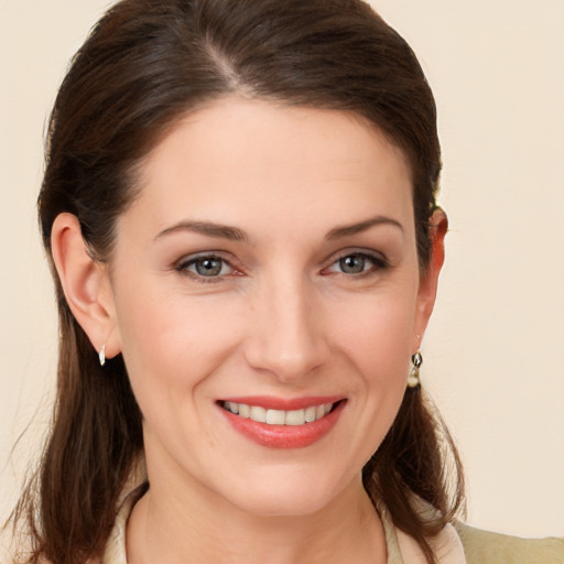 Joyful white young-adult female with medium  brown hair and brown eyes